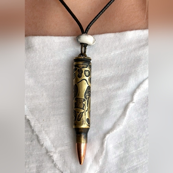 Engraved .223 Bullet with tip. Cow design with spots. 18" Necklace in black. - Picture 2 of 2